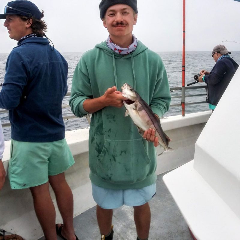 a person holding a fish