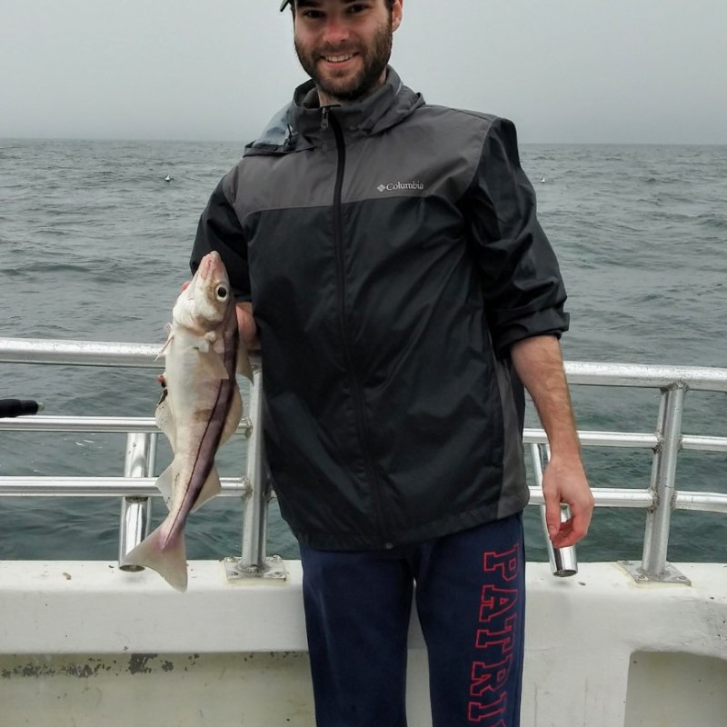 a person holding a fish in the water