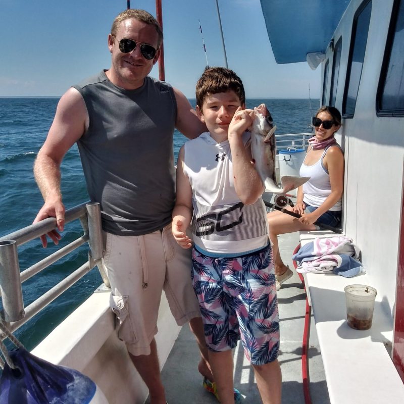 a person standing on a boat in the water