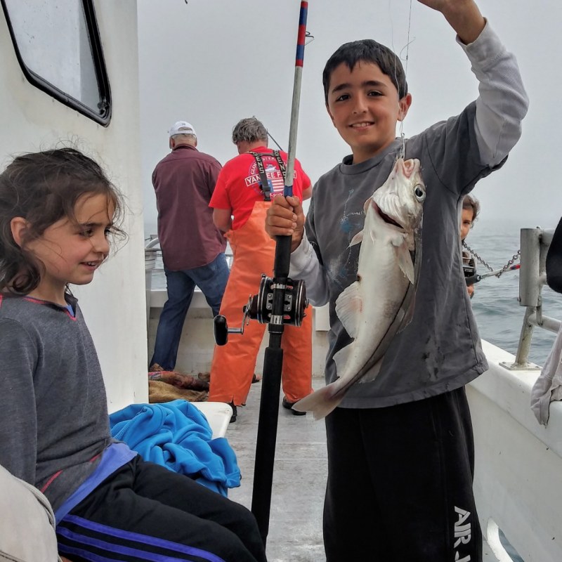 Elisha Henig et al. standing in the snow