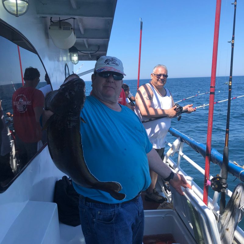 a group of people standing on a boat