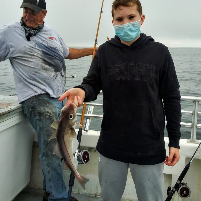 a person holding a fish