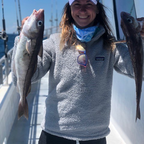 a person holding a fish