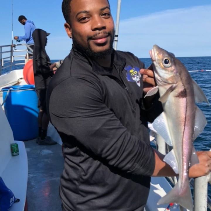 a person holding a fish