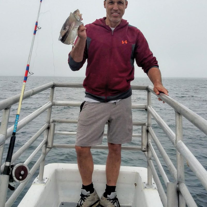 a man riding on the back of a boat