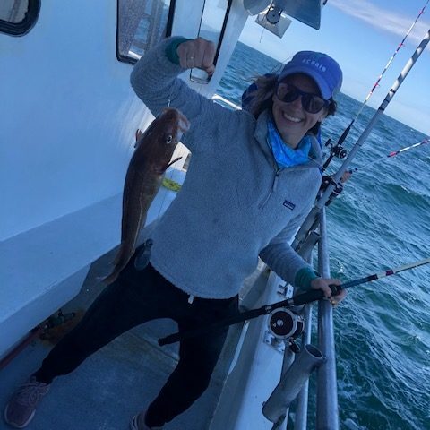 a person riding on the back of a boat