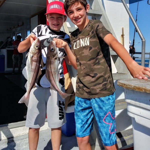 a person holding a fish