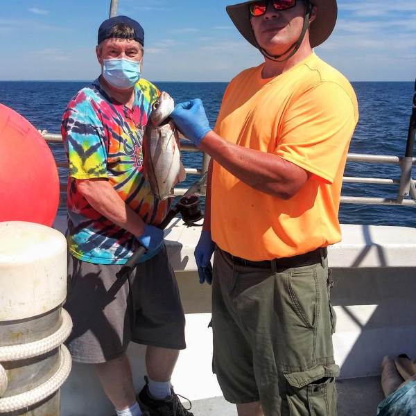 a group of people standing around a fire hydrant