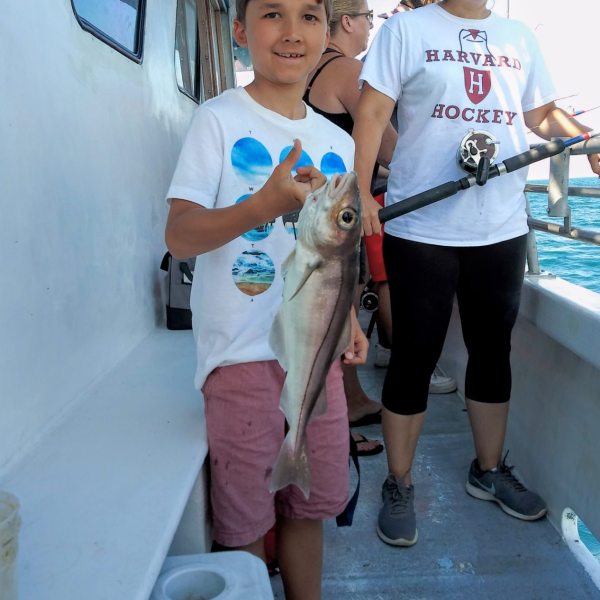 a person standing in front of a group of people posing for the camera