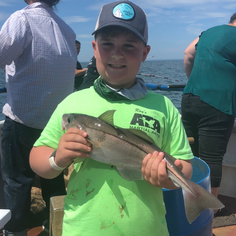 a person holding a fish
