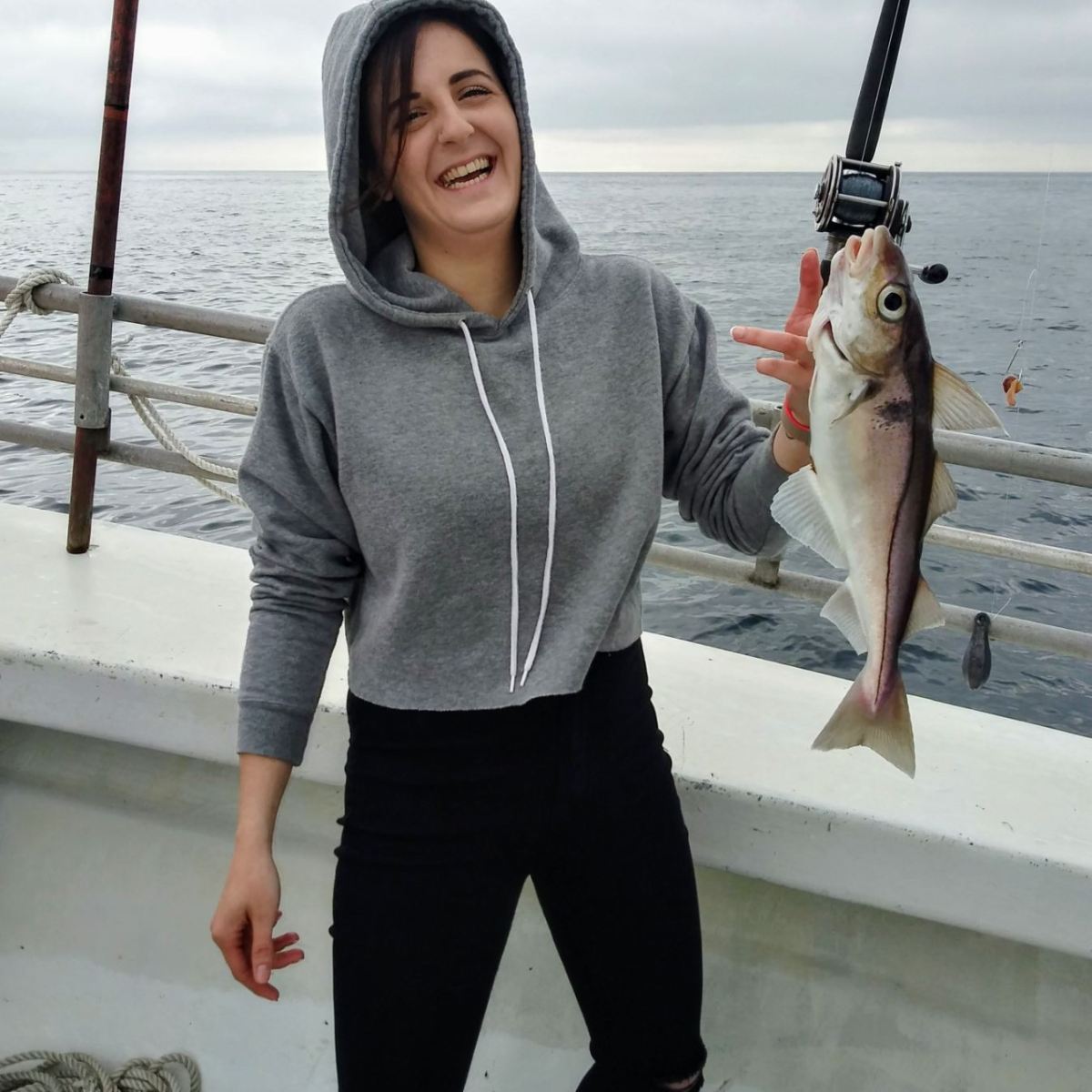 a person holding a fish in the water