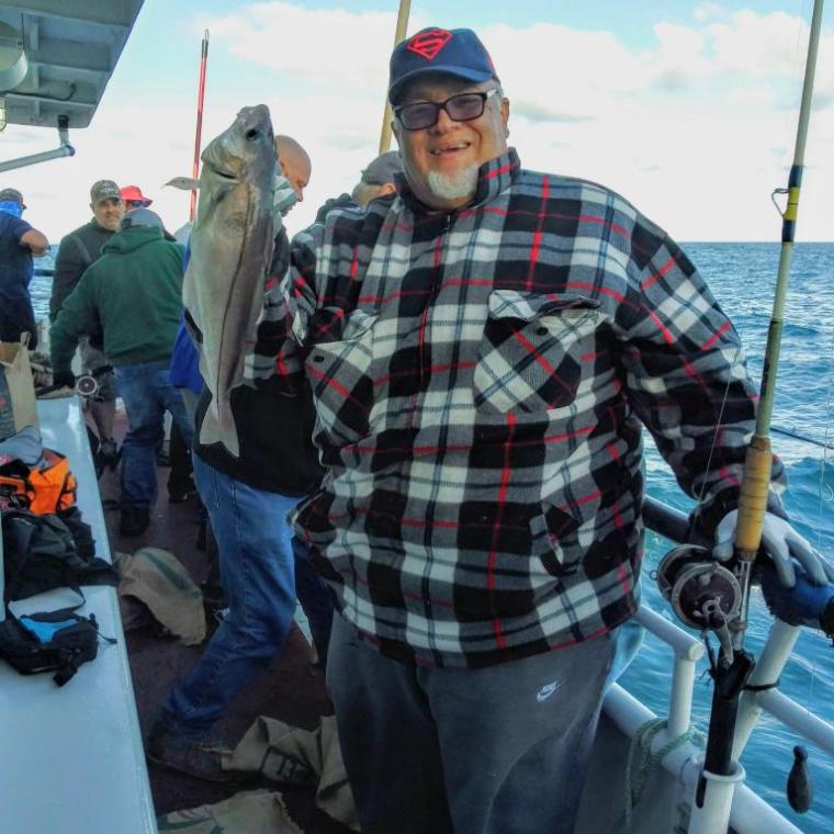 a group of people standing around a plane