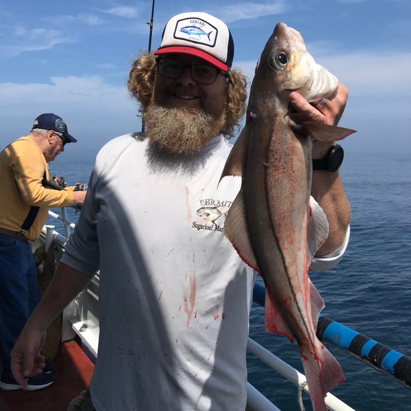 a man holding a fish