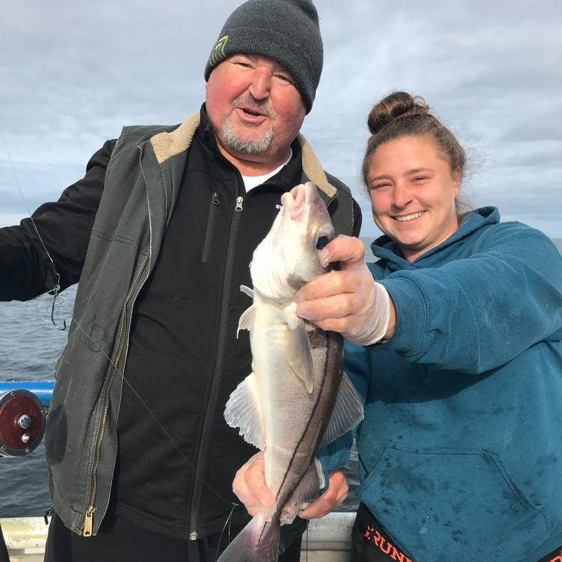 a person holding a fish