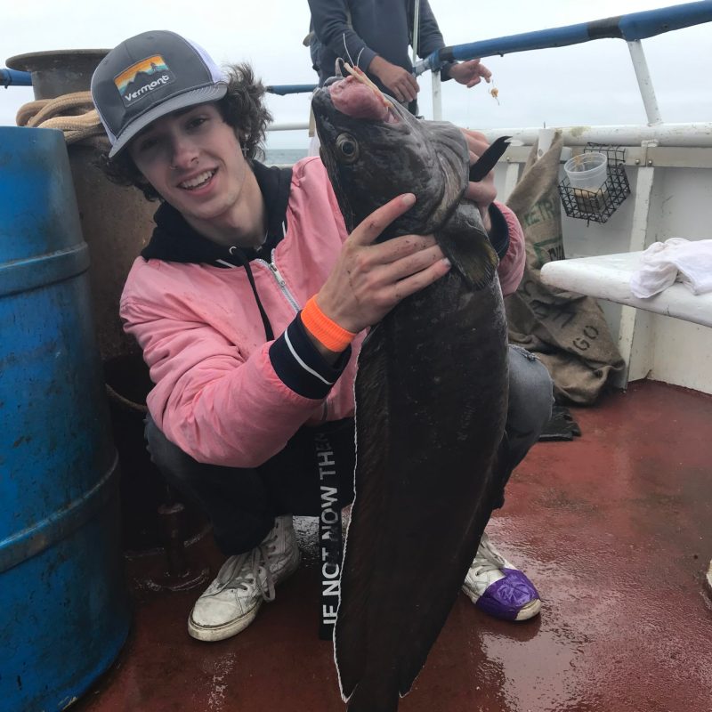 a person standing next to a fire hydrant