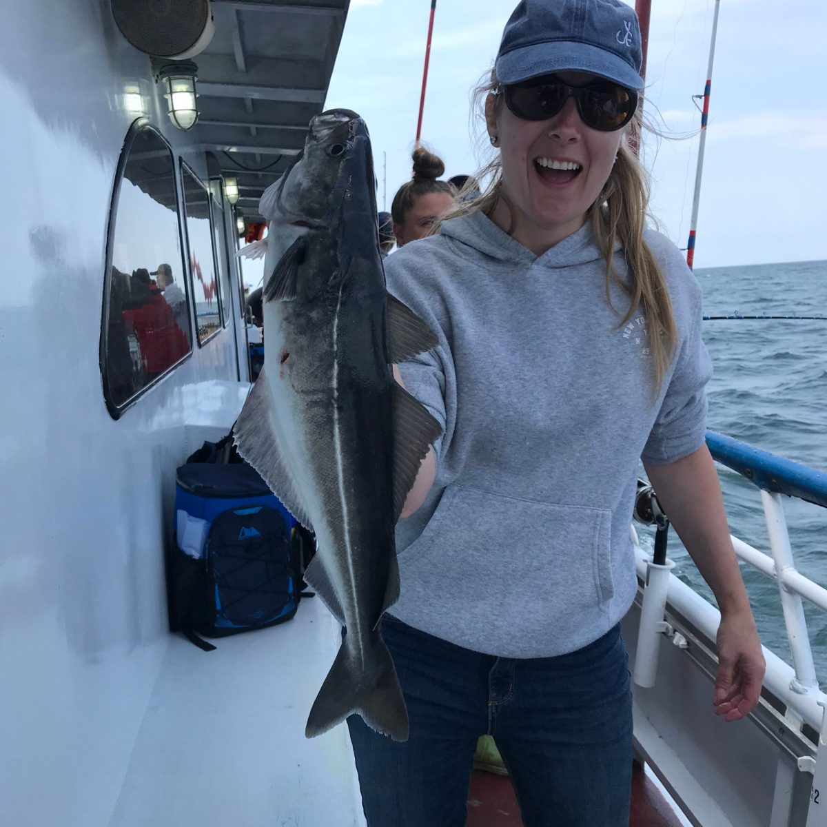 a person holding a fish