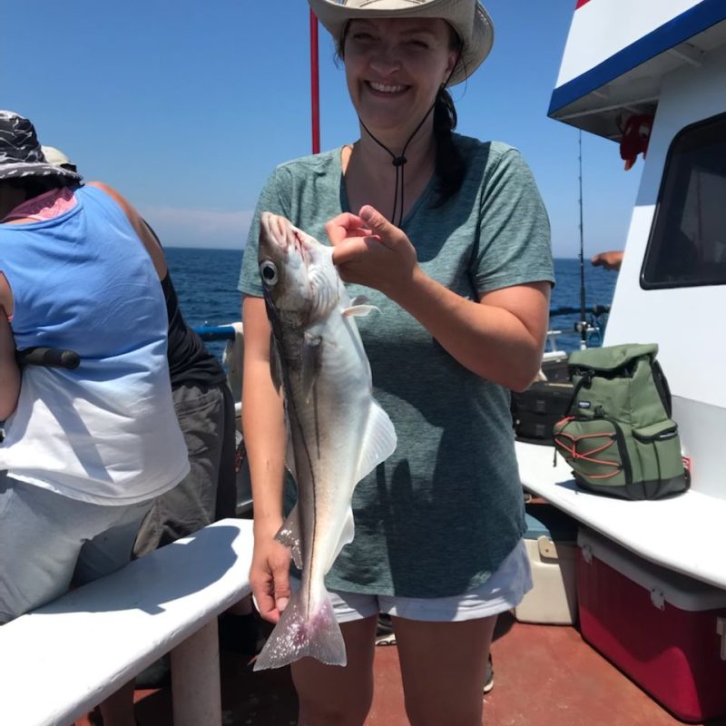 a person holding a fish