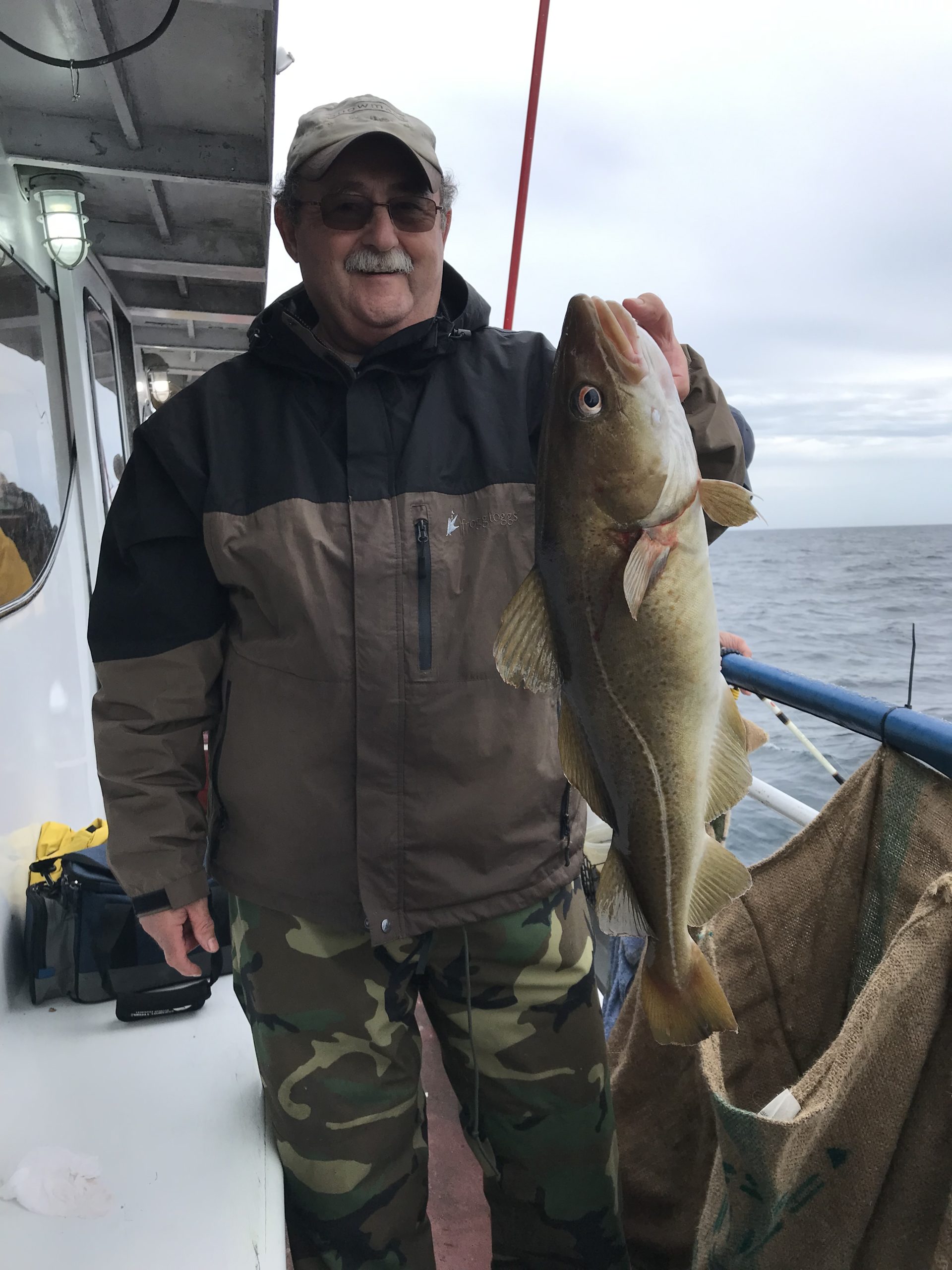 a man holding a fish