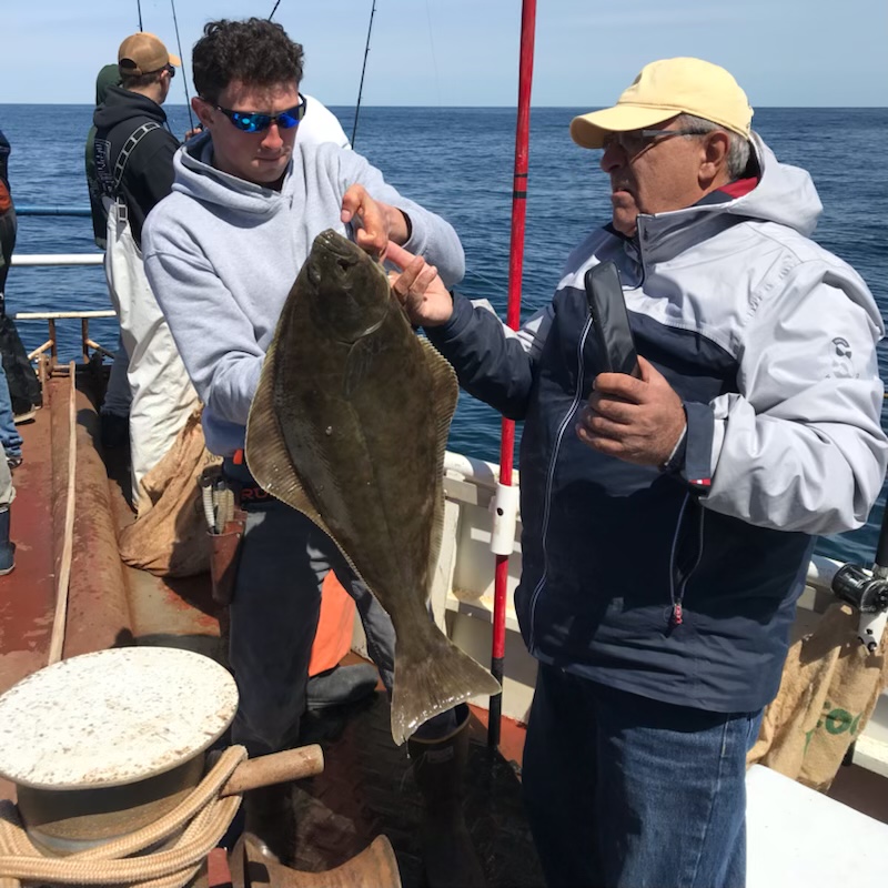 a person holding a fish