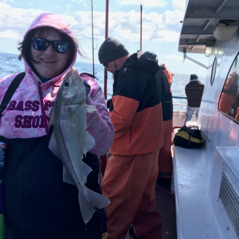 a person holding a fish