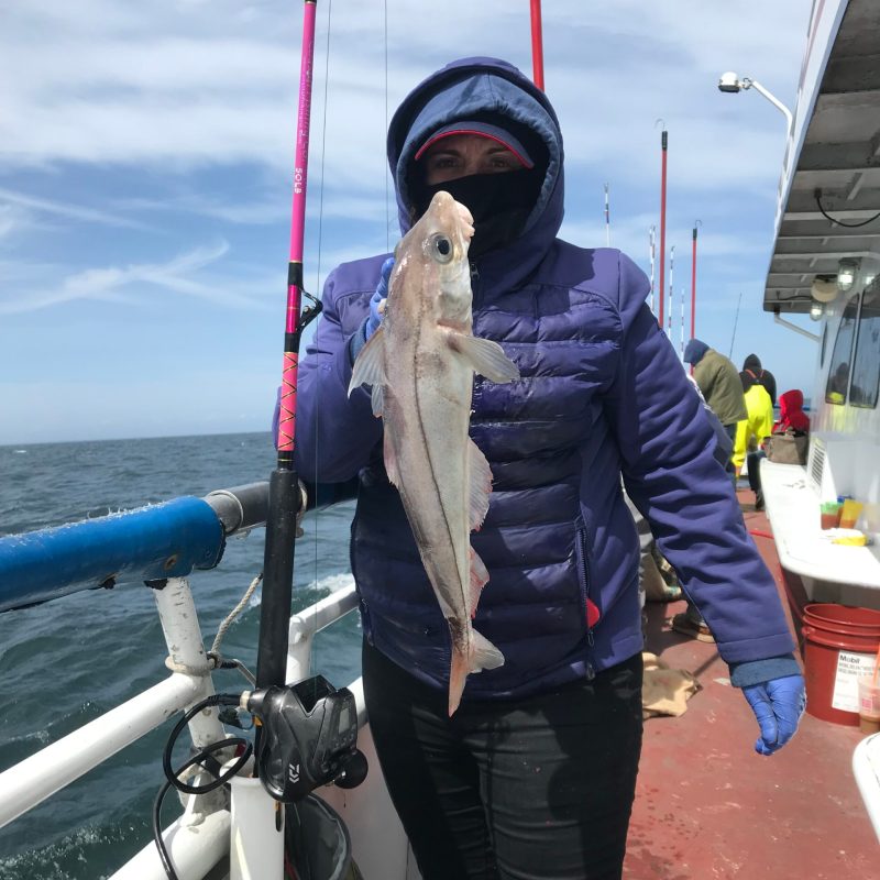 a woman is standing in the snow