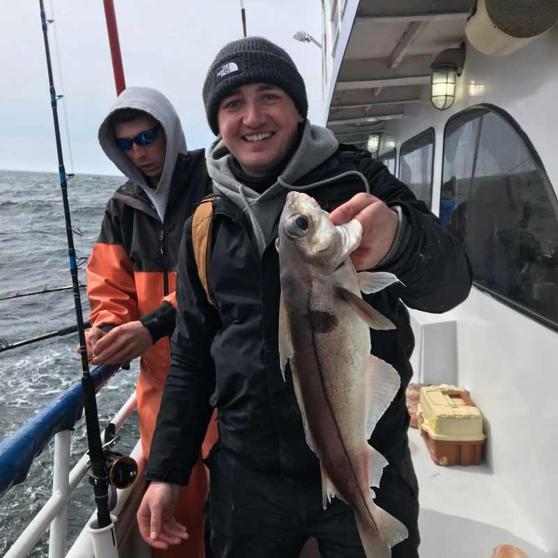 a person holding a fish