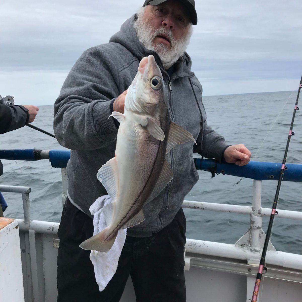 a man holding a fish in the water