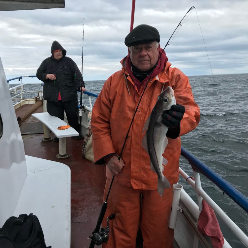 a person holding a fish