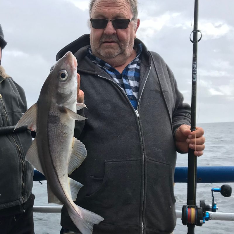 a man holding a fish