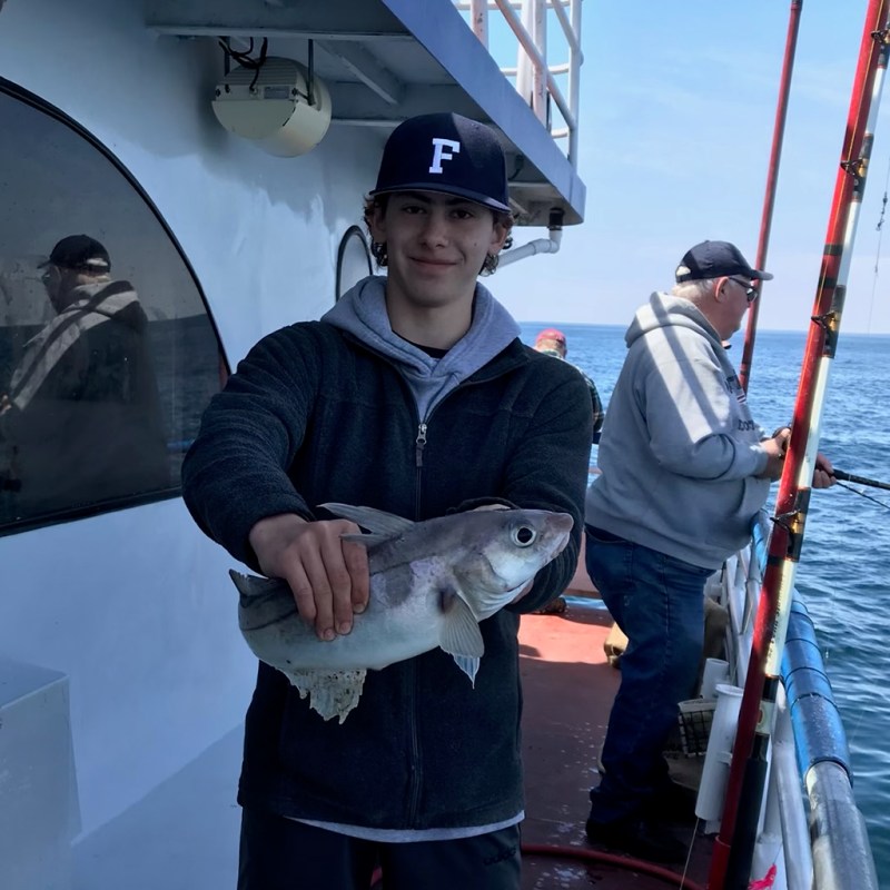 a person holding a fish
