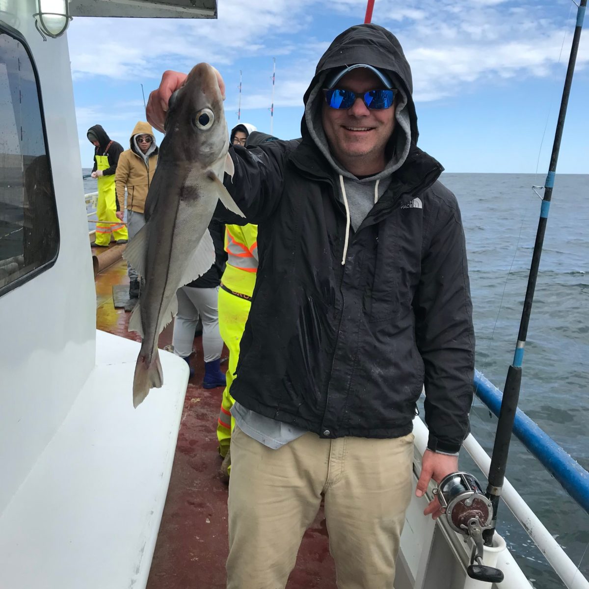 a person holding a fish