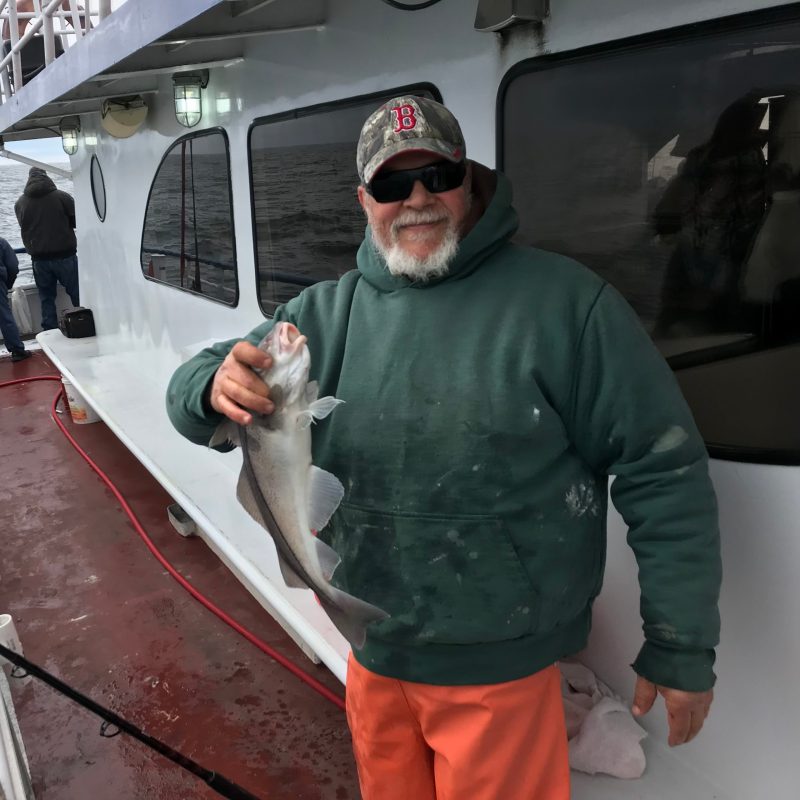 a man holding a fish