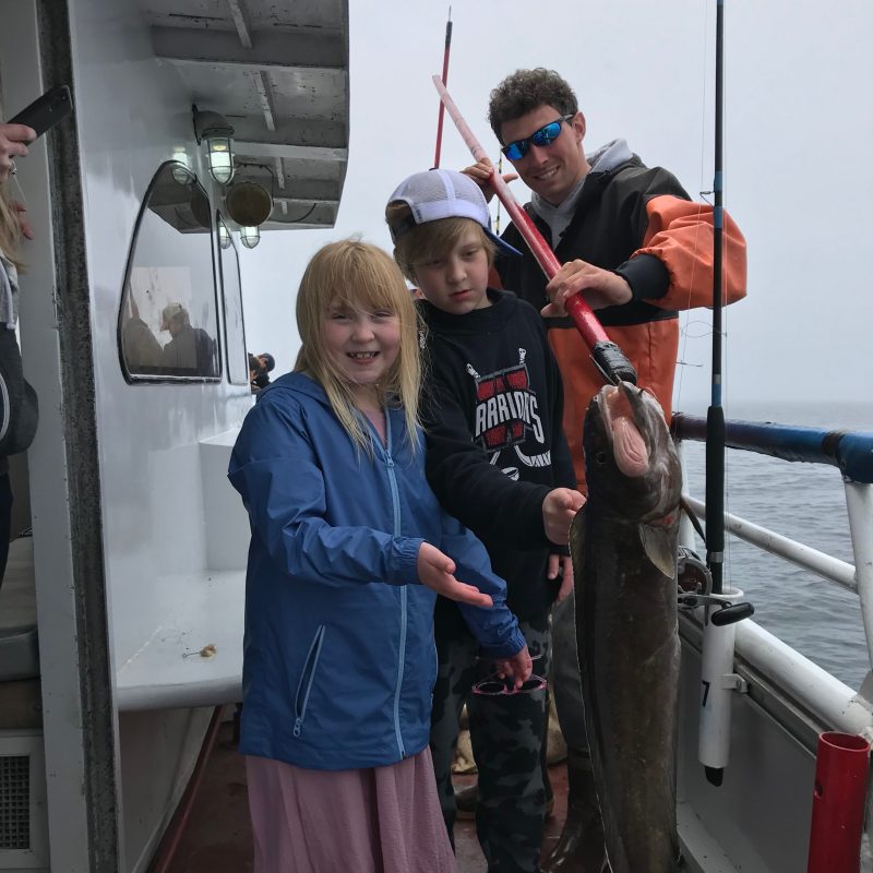 Lindsay Ridgeway standing next to a boat