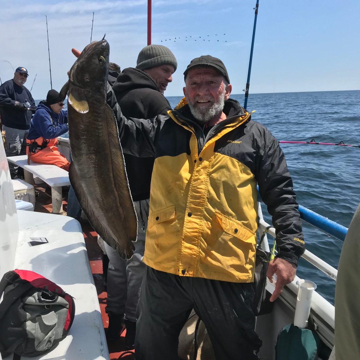 a couple of people that are standing in the snow