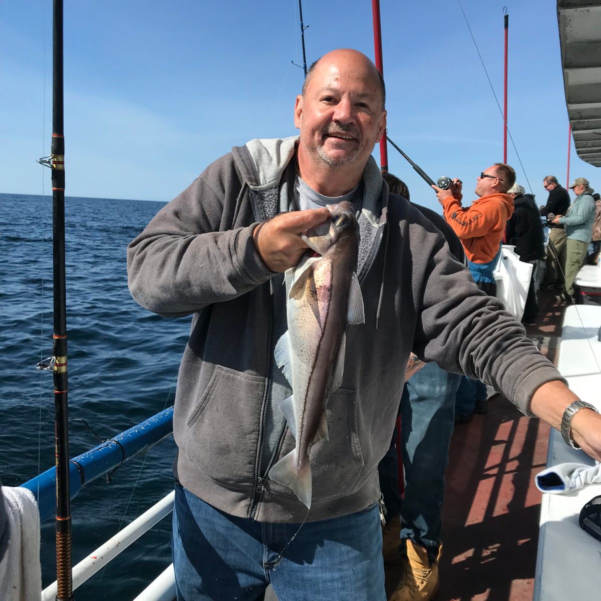 a man holding a fish