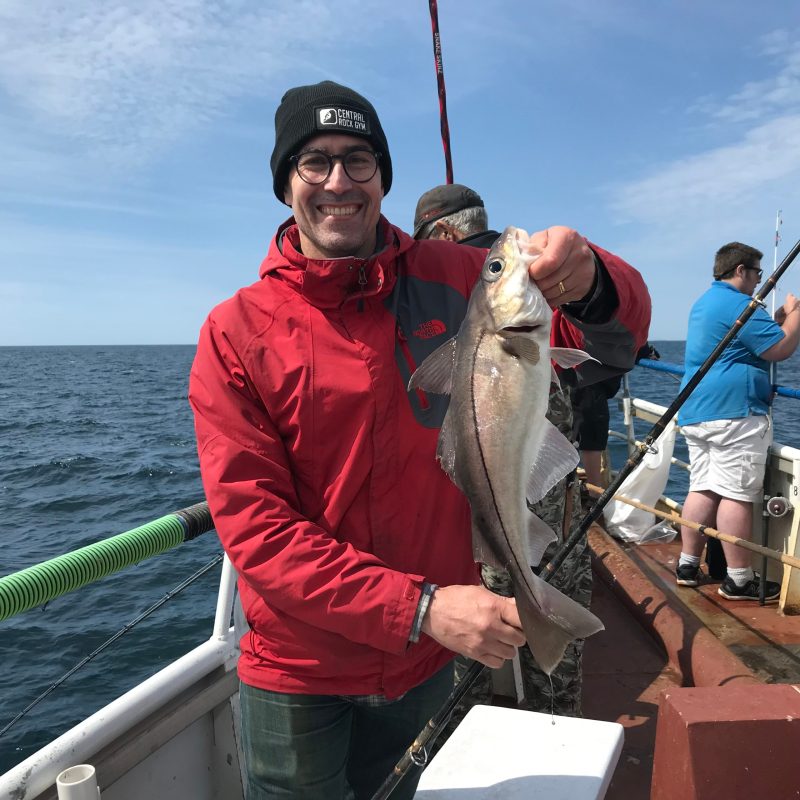 a man holding a fish