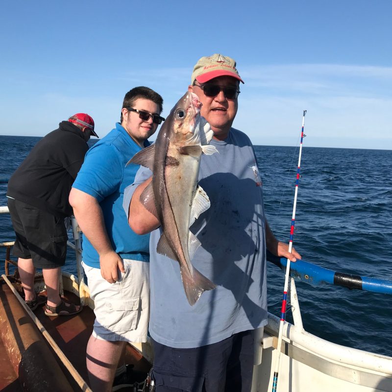 a group of people on a boat in the water