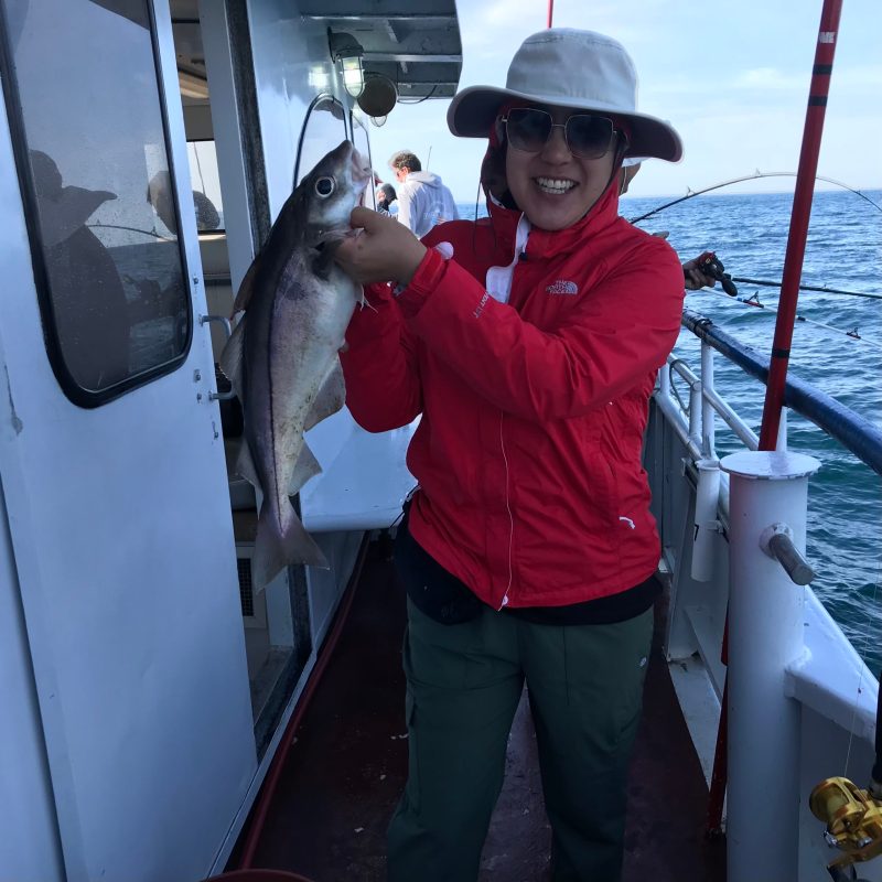 a person holding a fish