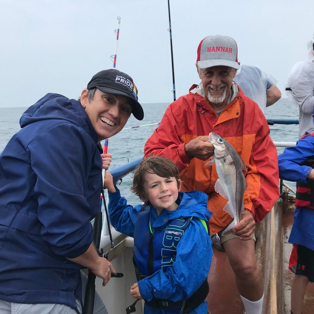 a group of people standing next to a child