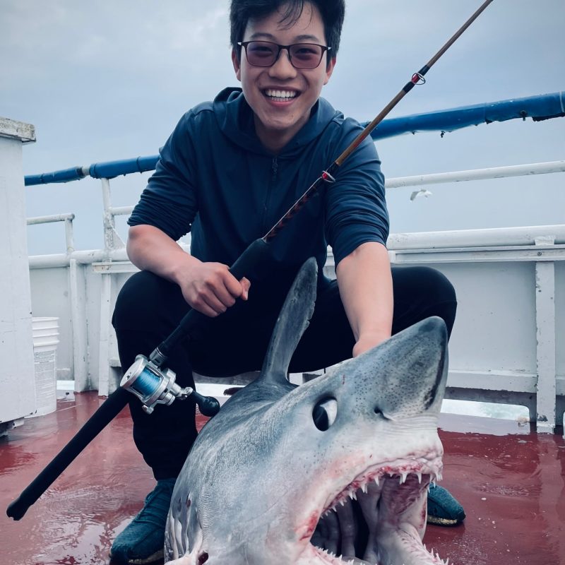 a man holding a fish