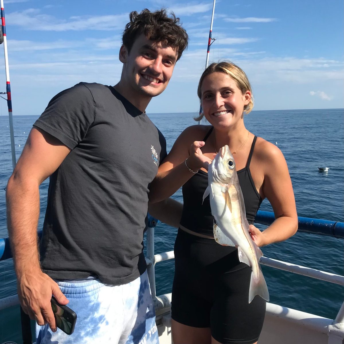 a person holding a fish in the water