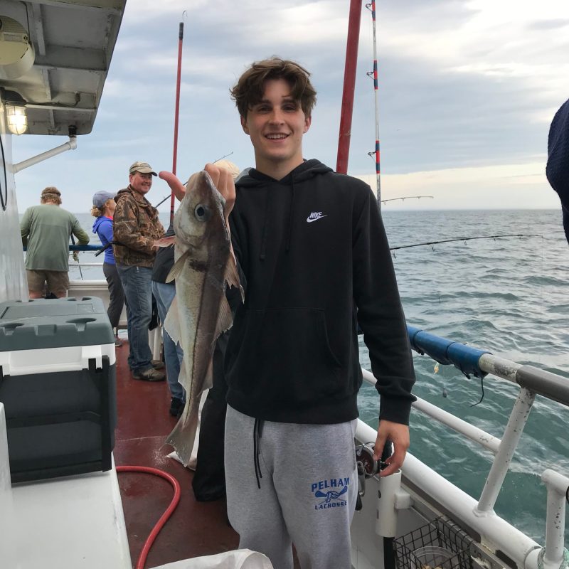 a group of people standing on a boat