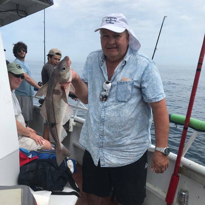 a person holding a fish