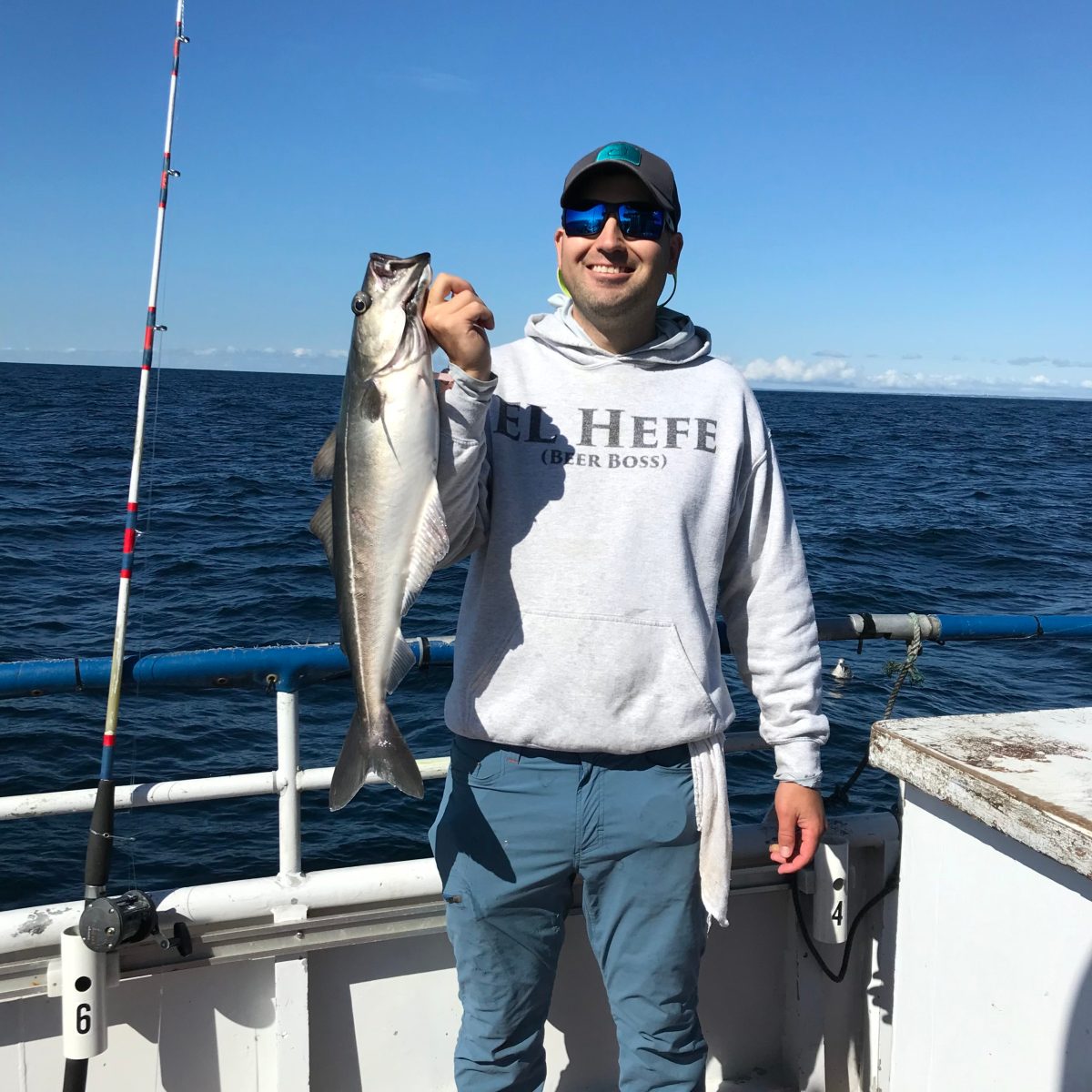 a man holding a fish in the water