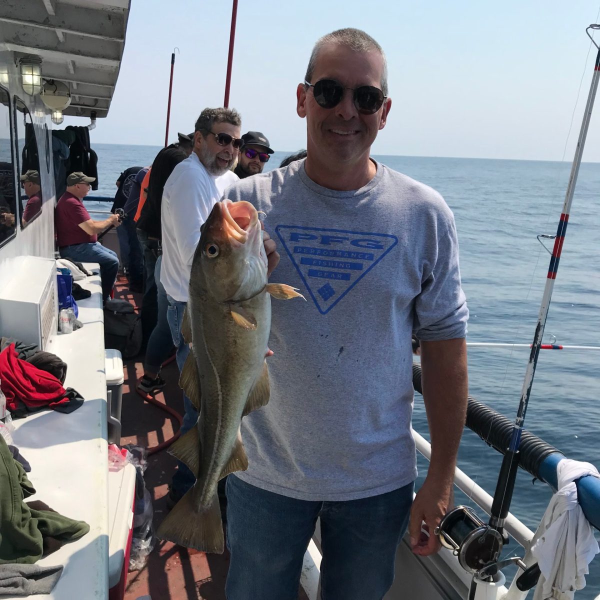 a person holding a fish in the water