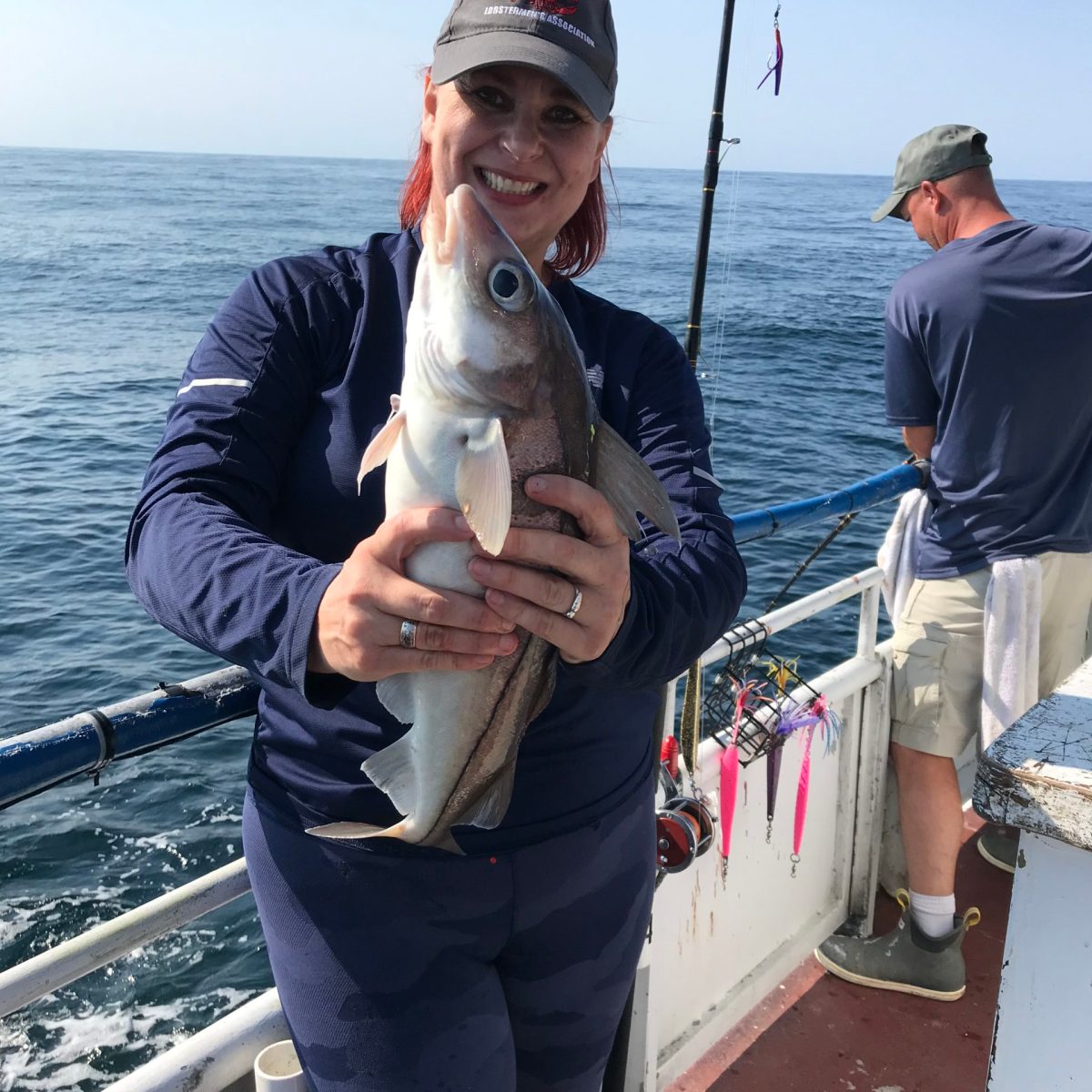 a person holding a fish in the water