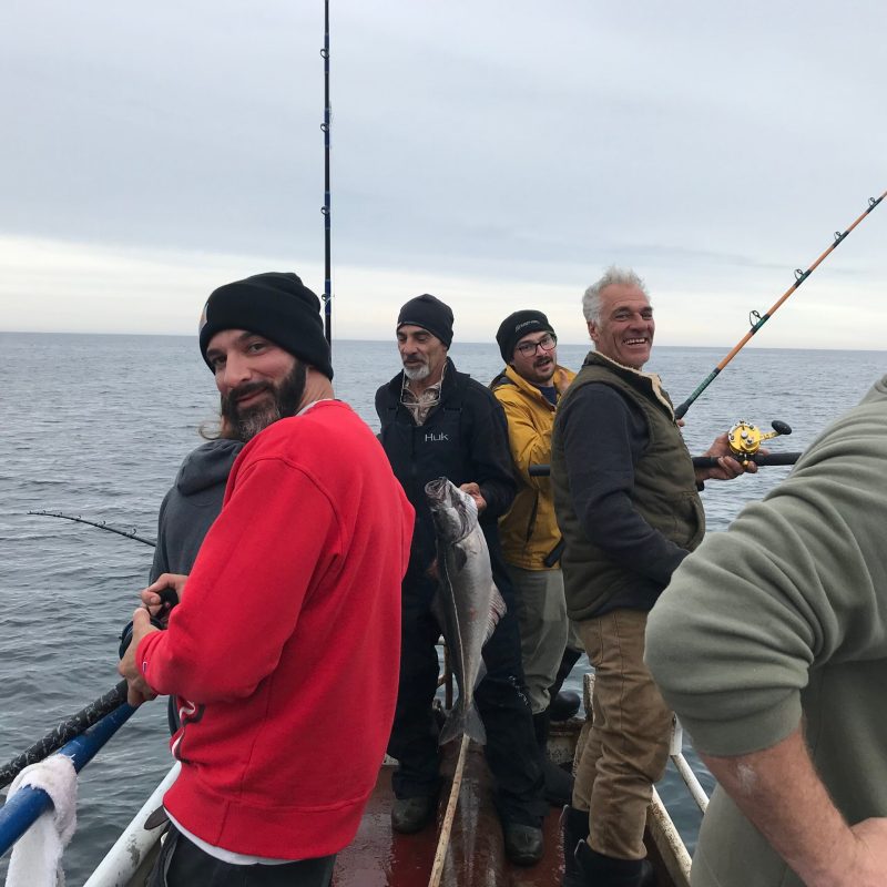 a group of people standing in the water