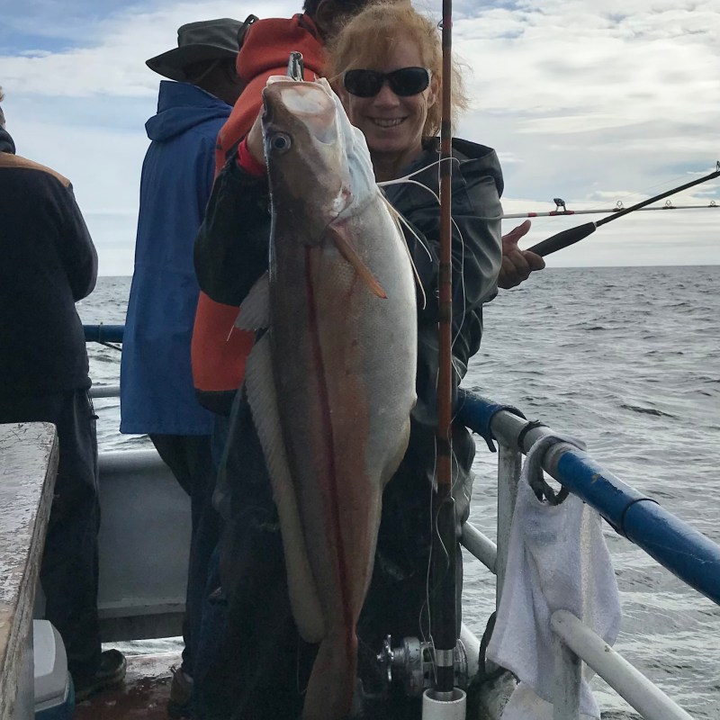 a man holding a fish