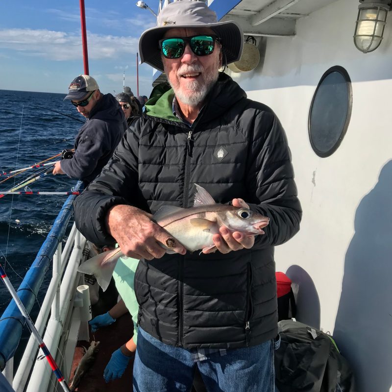 a person holding a fish