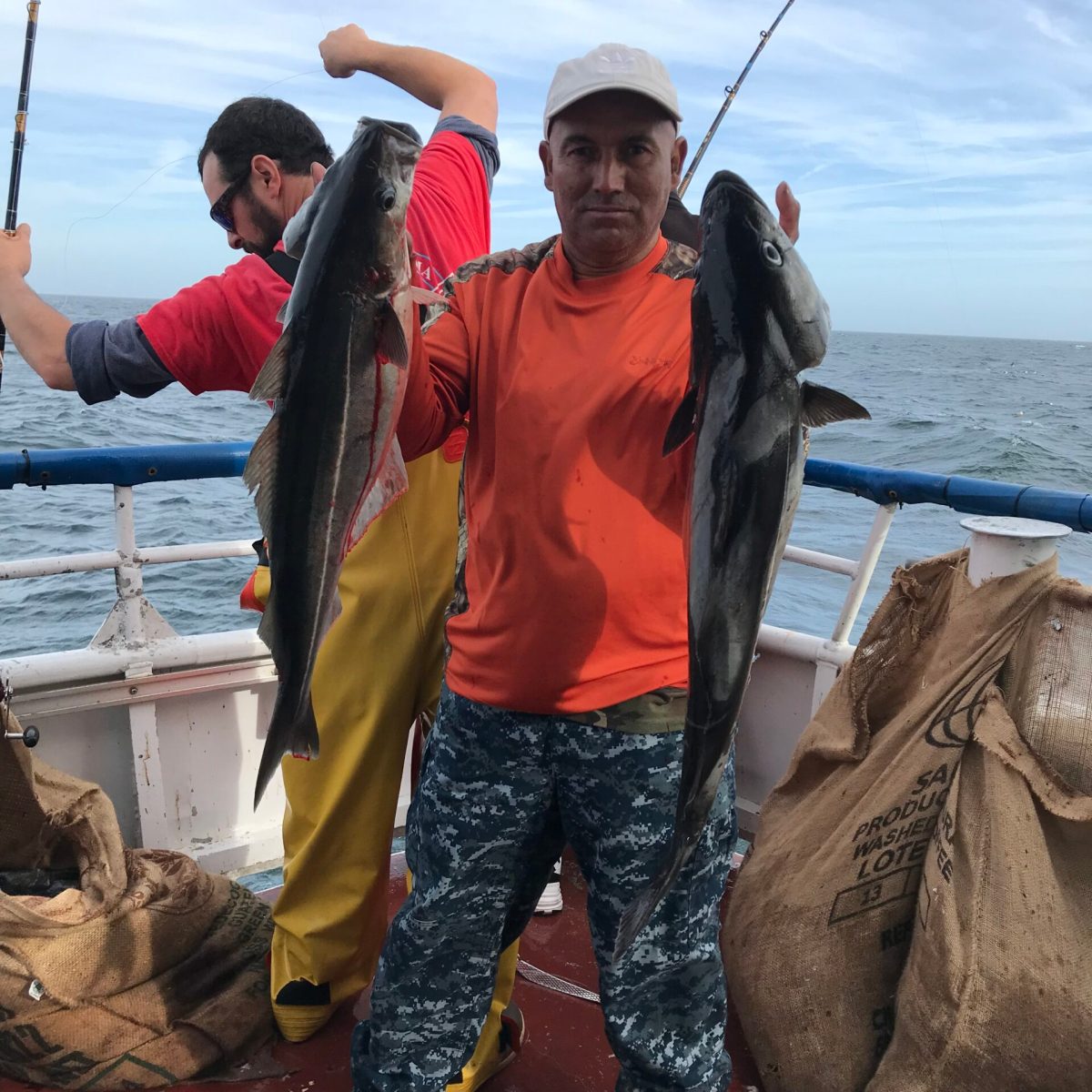 a man holding a fish in the water